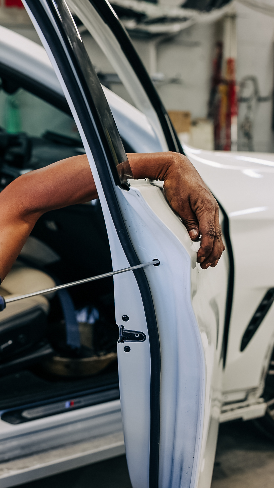 Close-up of door pillar dent restoration work at Quality Auto Body in Fairfax, VA