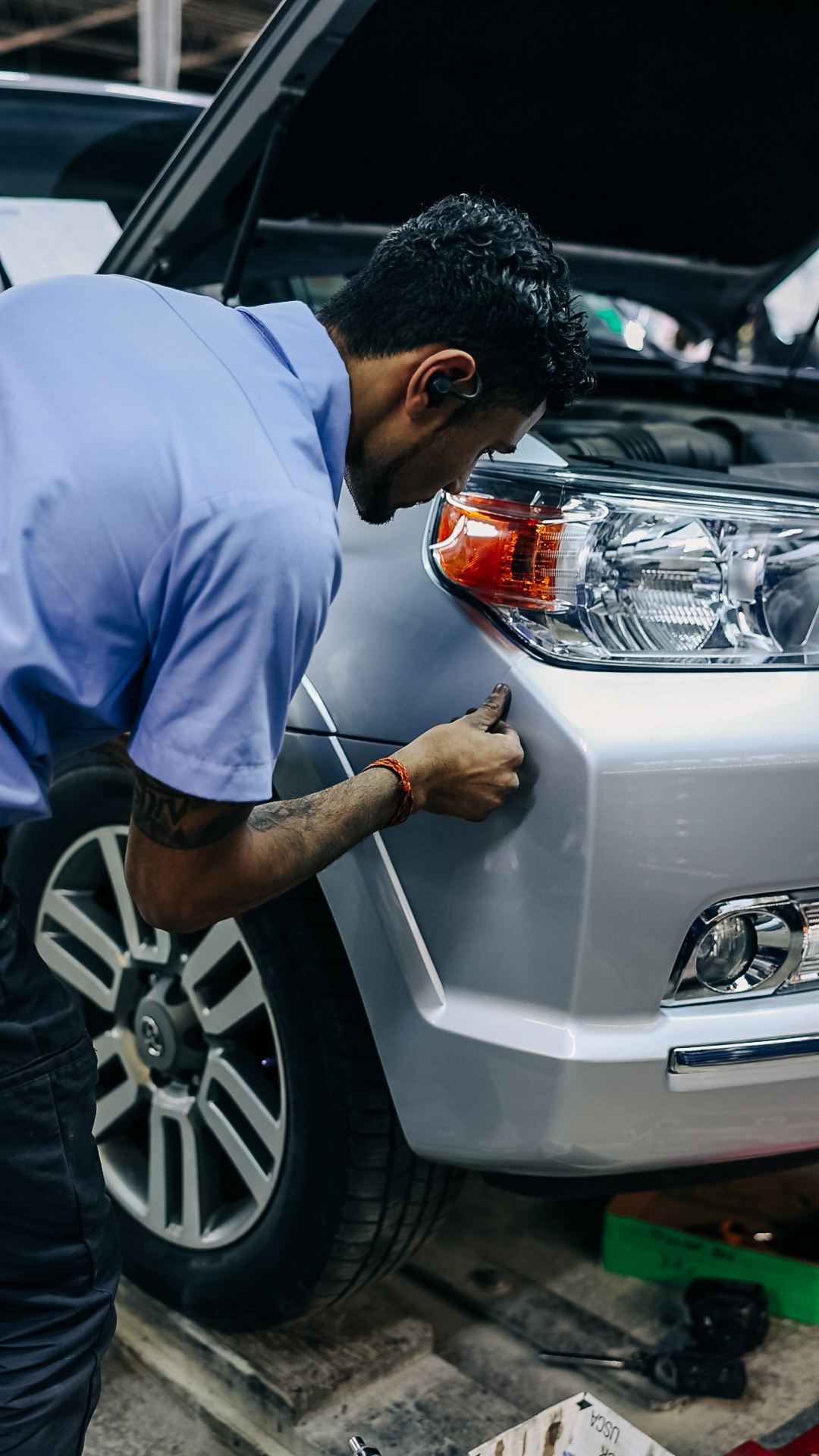 Auto repair technician at Quality Auto Body shop in Fairfax, VA